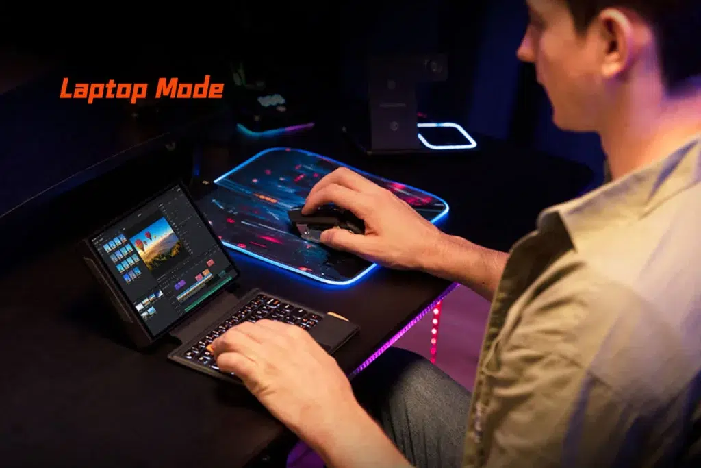 gempages5227571092389898430221d68c3ed848b8bb02e72d0ed70a91 DROIX Global The ONEXPLAYER X1 Mini used as a compact laptop setup with a keyboard and mouse running video editing software highlighting its versatility for creative and productivity tasks