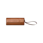 AYANEOMICROPROTECTIVELEATHERCASE DROIX Global AYANEO Micro Protective Leather Case in brown featuring a compact cylindrical design with a fold over flap secured by a magnetic closure The case has a wrist strap attached for easy carrying and the AYANEO logo is embossed on the front Designed to provide stylish and durable protection for AYANEO Pocket Micro devices