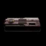 Direct top down view of the AYANEO AG01 against a black background clearly showing the engraved branding and heat vents